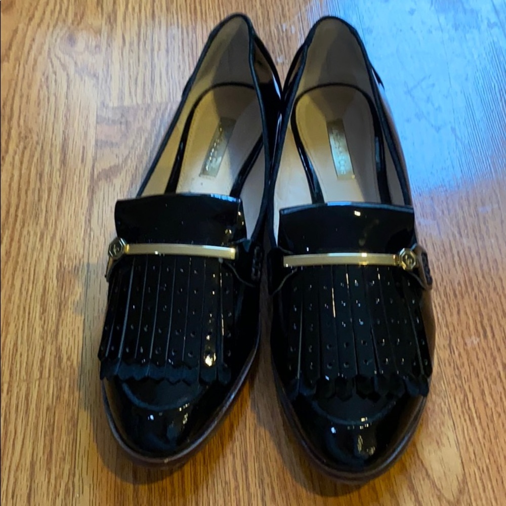 Women’s flat black patent leather shoes